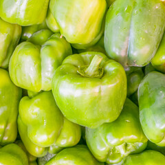 colorful green peppers top view closeup, natural background