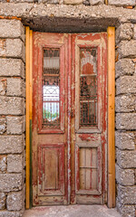 Fototapeta na wymiar abandoned house entrance wooden frame door and insde view to open window