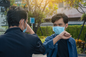 Asian man a wearing face mask shake hand new normal no touch  concept social distancing