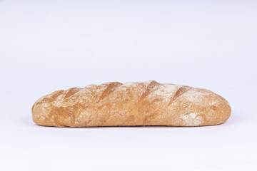 fresh rye loaf of bread on a white background