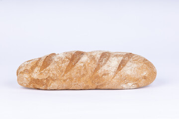 fresh rye loaf of bread on a white background