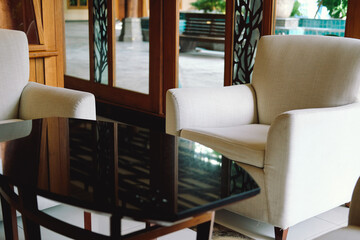 beige cushion sofa chair armchair in living room.