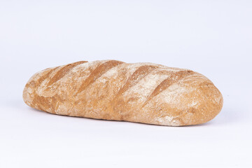 fresh rye loaf of bread on a white background