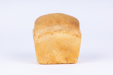 a small loaf of fresh crunchy wheat bread on a white background