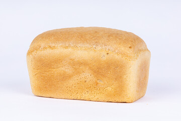 a loaf of fresh wheat bread on a white background