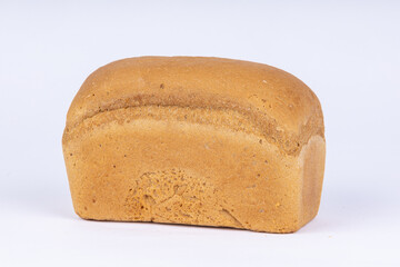 a loaf of fresh wheat bread on a white background