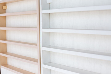 White Wooden Shelf on a Wall in Light Room.