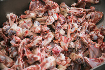 Box with blood bones in butchery of meat producing farm