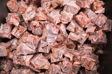 square - cut pieces of frozen pork meat. Production of meat semi- finished products.