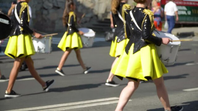 Young girls drummer at the parade. Street performance. Majorettes in the parade