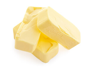 Pieces of butter isolated on white background. Butter stick top view. Flat lay