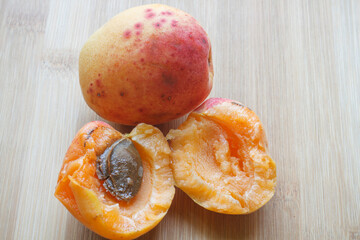  fresh apricot close-up on a wooden board 