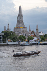 BANGKOK - AUG 6, 2020 : Wat Arun Ratchawararam Ratchawaramahawihan or Wat Arun is a Buddhist temple in Bangkok Yai district of Bangkok, Thailand, on the Thonburi west bank of the Chao Phraya River.