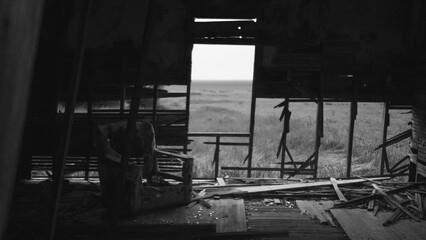 abandoned farmhouse with fog on the prairie