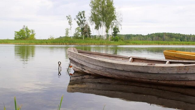 Boat on a calm summer lake. Relax video with nature. Zen meditative nature background