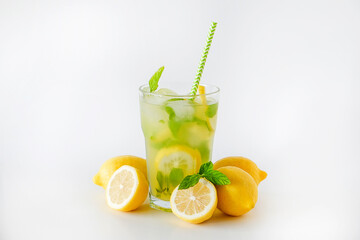 Single glass of iced lemonade. Studio shot of refreshing non alcoholic mojito drink with lemon...