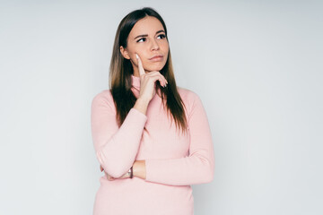 Thoughtful woman with hand on chin