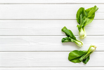 Bok choy on white table top view copy space