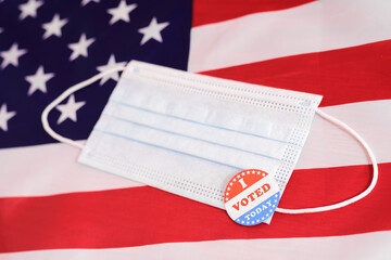 American voters must register by filling out a form even during the pandemic, wearing a face mask when voting.