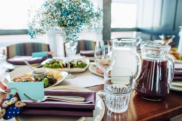 Festive dinner table in the restaurant with food, plates, glasses. Great table set