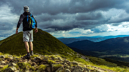 Standing at the top of the hill in the mountains. Hiking in the mountains. Poland Bieszczady. © K.Miłkowski