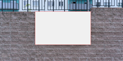 empty white board with mock-up space hanging on brick wall on city urban street
