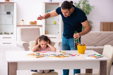 Drunk father and little girl indoors