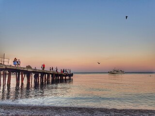 Naklejka na ściany i meble Crimean holidays. The sea view from the waterfront Gurzuf. Sunset.