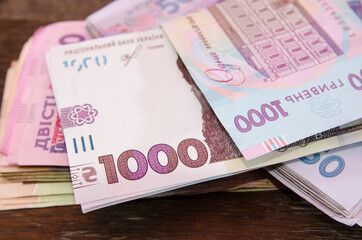 banknotes of 1000 hryvnia on the background of money. Close-up. Much money. Financial concept. A stack of hryvnias.