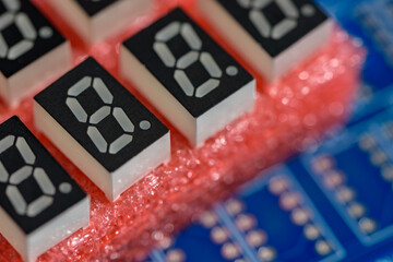 Electronic components, 7-segment LED (blue PCB background)