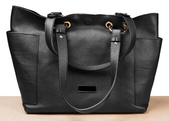 black leather ladies bag, on a white background, frontal arrangement