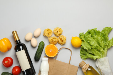 Different food on gray background, top view