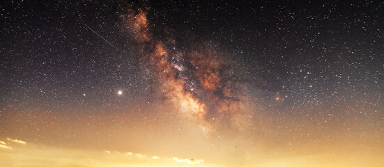 Beautiful starry sky with bright milky way galaxy. Night landscape. Astronomical background.