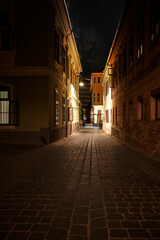 Fototapeta na wymiar Old European street after dark. Brasov,Romania