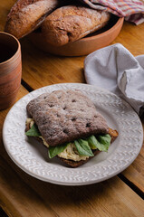 sandwich (bruschetta) made from whole grain bread with cheese and spinach. Healthy snack, healthy food.