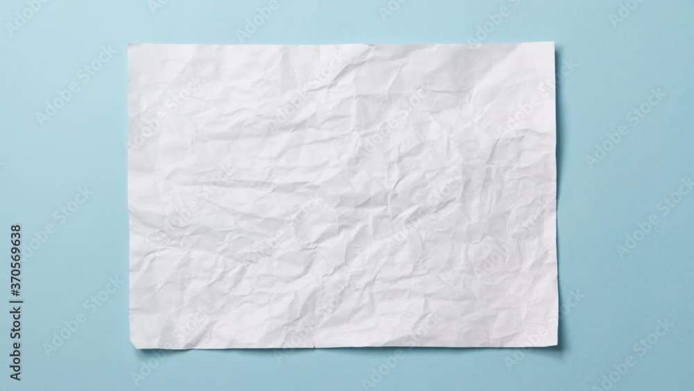 Wall mural white crumpled paper texture on light blue background. stop motion animation. seamless loop. you can