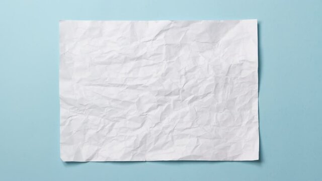 White crumpled paper texture on light blue background. Stop motion animation.
Seamless loop. You can combine this clip with paper balls and icons to make a message or tale, more options in my profile.