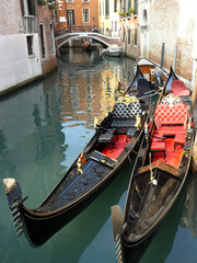 Fototapeta na wymiar Venice (Italy). Detail of Venetian gondolas on a city canal