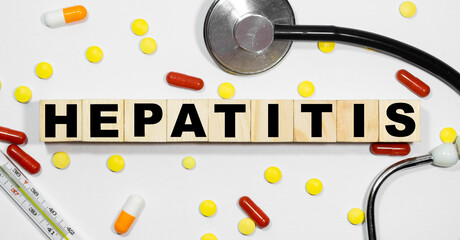 Wooden block form the word HEPATITIS. Medical concept.