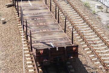 Open freight platforms for transporting large objects, on the railway track. 