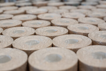 Wallpaper rolls are stacked neatly in the store