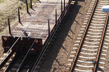 Fototapeta na wymiar Open freight platforms for transporting large objects, on the railway track. 