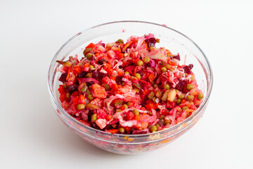 Traditional Russian salad vinaigrette on glass bowl. Step by step salad recipe