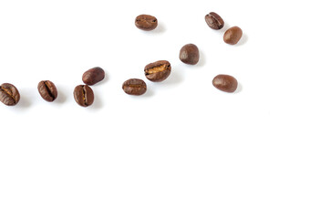 Roasted coffee beans on wooden texture background.