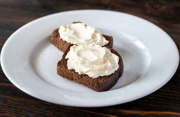 Slices of rye bread with cream cheese