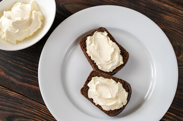Slices of rye bread with cream cheese