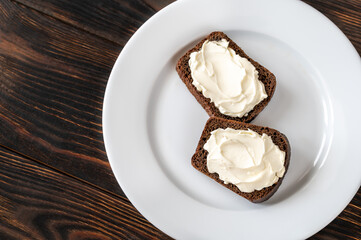 Slices of rye bread with cream cheese