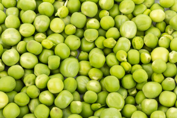 Green young peas, isolated on white background. Close-up. Top view