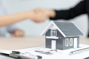 Property manager Shake hands with congratulations on the customers who bought the house with...