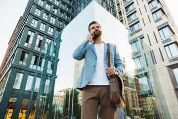 Young urban businessman on smart phone